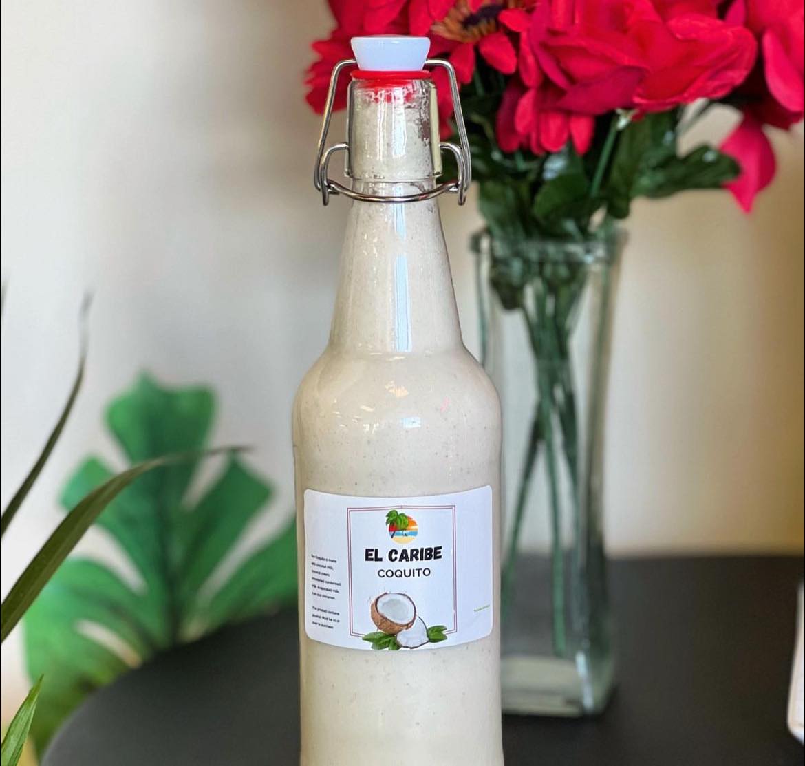 Bottle of house-made El Caribe Coquito