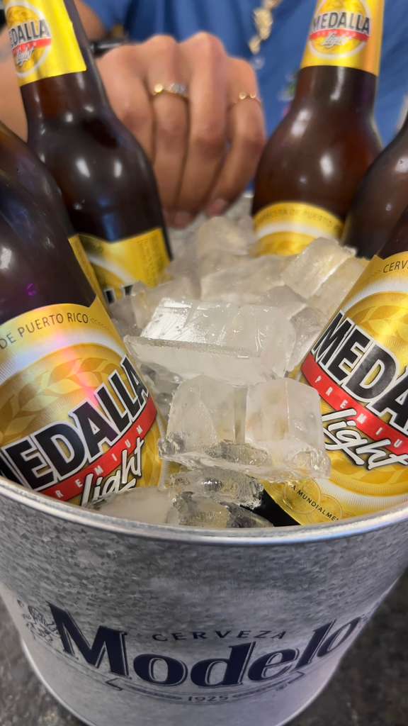 Bucket of ice-cold Medalla Light cervezas from Puerto Rico in a Modelo bucket